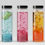 A creative assortment of fruit and berry-infused drinks in glass bottles: final result of a professional beverage formulation process.